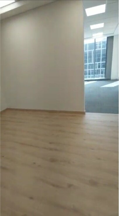 Light wood floor in an open office space - office in Cairo Festival City, New Cairo