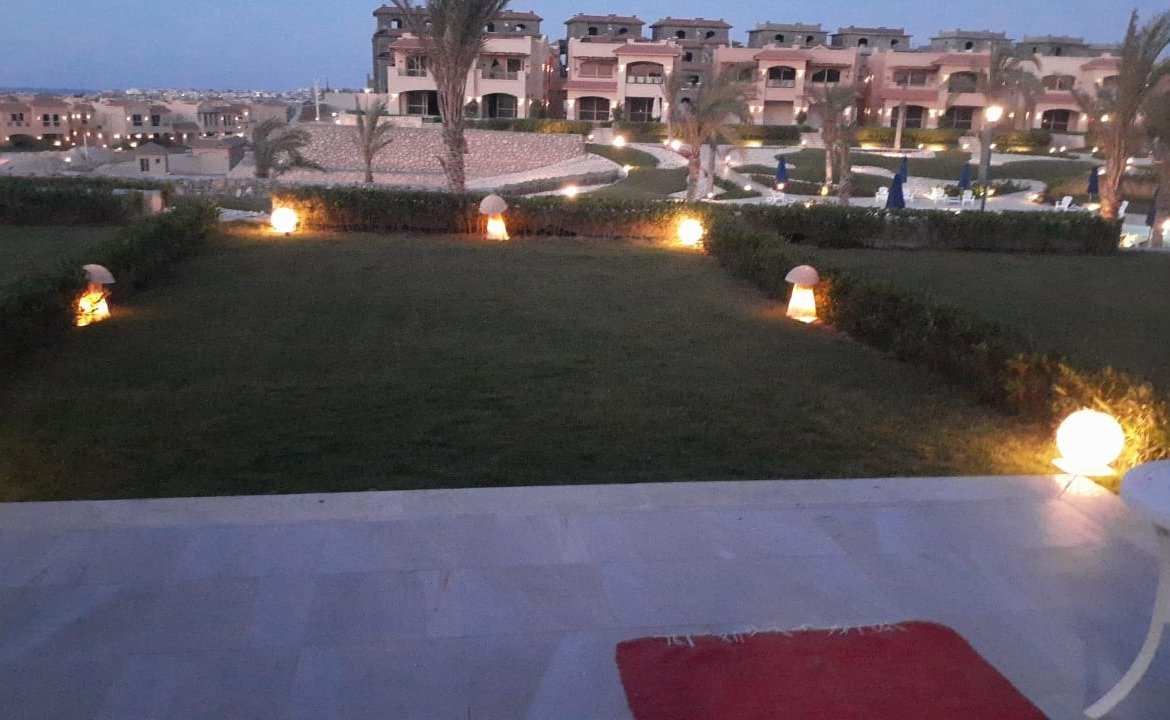 Garden view at dusk, La Vista Bay East North Coast twin house for sale | إطلالة الحديقة عند الغروب، توين هاوس للبيع في لافيستا باي إيست الساحل الشمالي