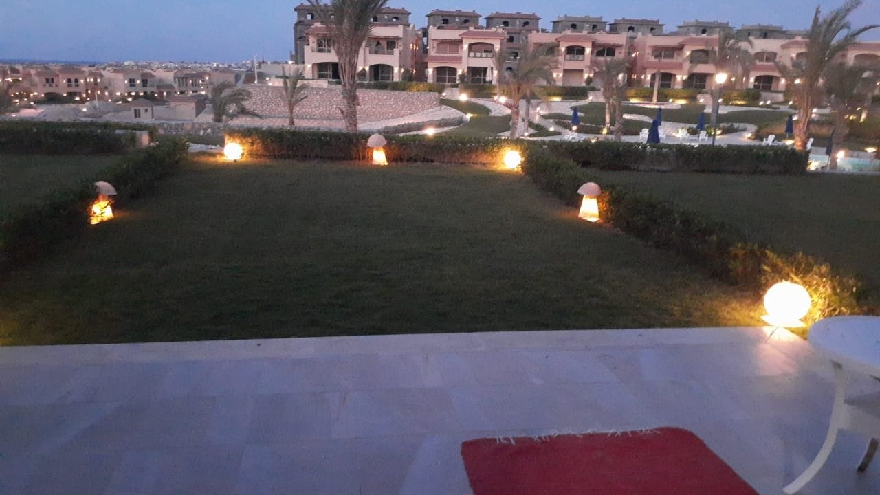 Garden view at dusk, La Vista Bay East North Coast twin house for sale | إطلالة الحديقة عند الغروب، توين هاوس للبيع في لافيستا باي إيست الساحل الشمالي