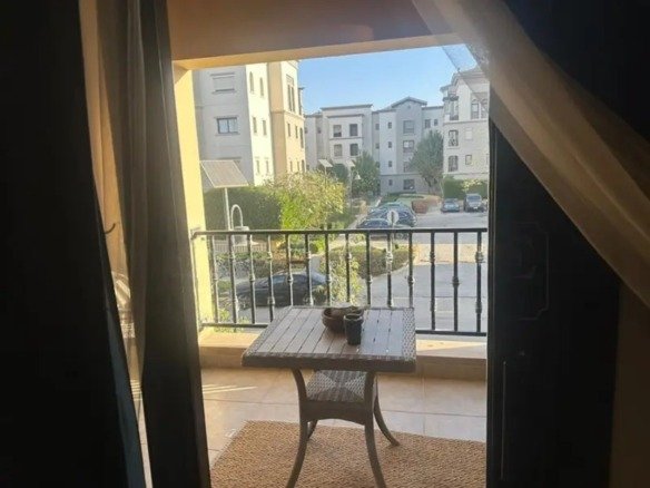 Balcony overlooking the main road, Mivida Parcel23 apartment for sale | بلكونة تطل على الشارع الرئيسي، شقة للبيع في ميفيدا بارسل23
