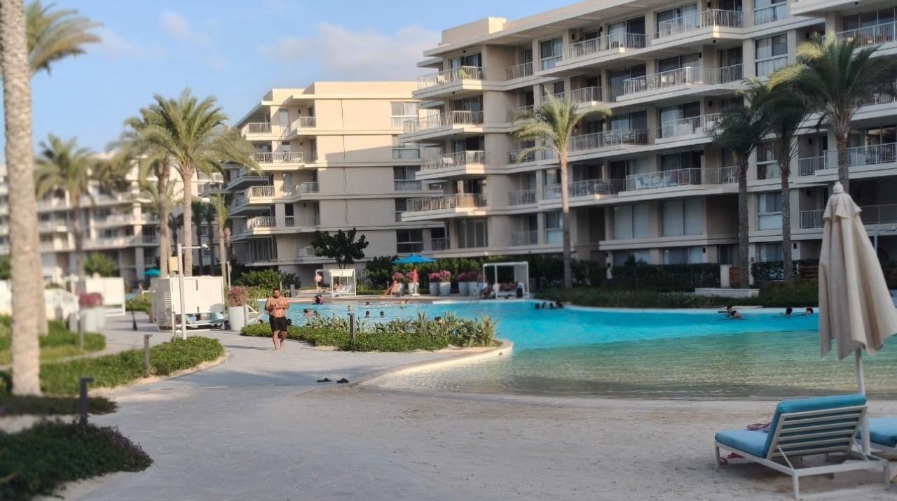 23-marassi-marina-views-293-02 Buildings and lagoon-side walkway, chalet for rent in Marassi Marina Views, North Coast | المباني والممشى بجوار اللاجون، شاليه للإيجار في مراسي مارينا فيوز، الساحل الشمالي