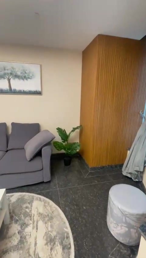 231-f03 Bedroom with a grey armchair and a wooden wardrobe - hotel apartment in Marassi
