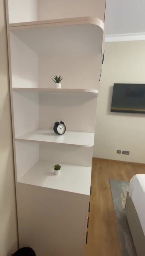 231-f07 White shelving unit beside a bedroom wall - hotel apartment in Marassi