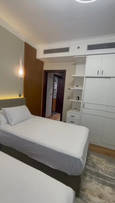231-f08 Bedroom with a white cover and a wall TV - hotel apartment in Marassi
