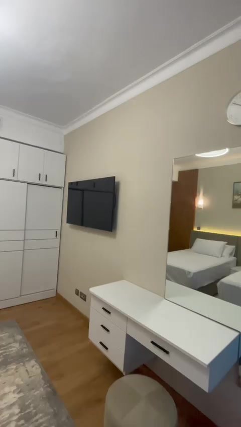 231-f09 Bedroom with a white vanity and a mirrored wardrobe - hotel apartment in Marassi