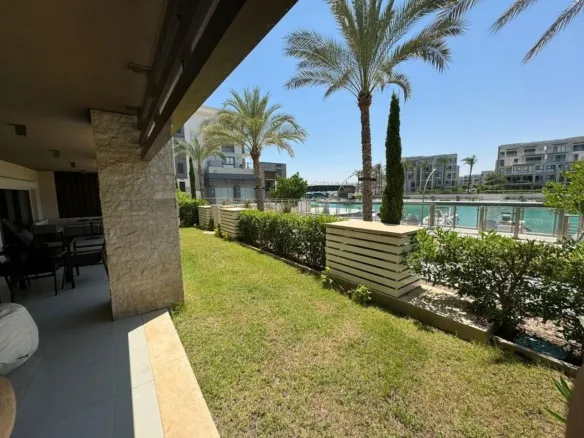 Garden and outdoor view by the canal, Marassi Marina Residences, North Coast | حديقة وإطلالة خارجية بجوار القنال، شاليه للإيجار في مراسي مارينا ريزيدنس، الساحل الشمالي