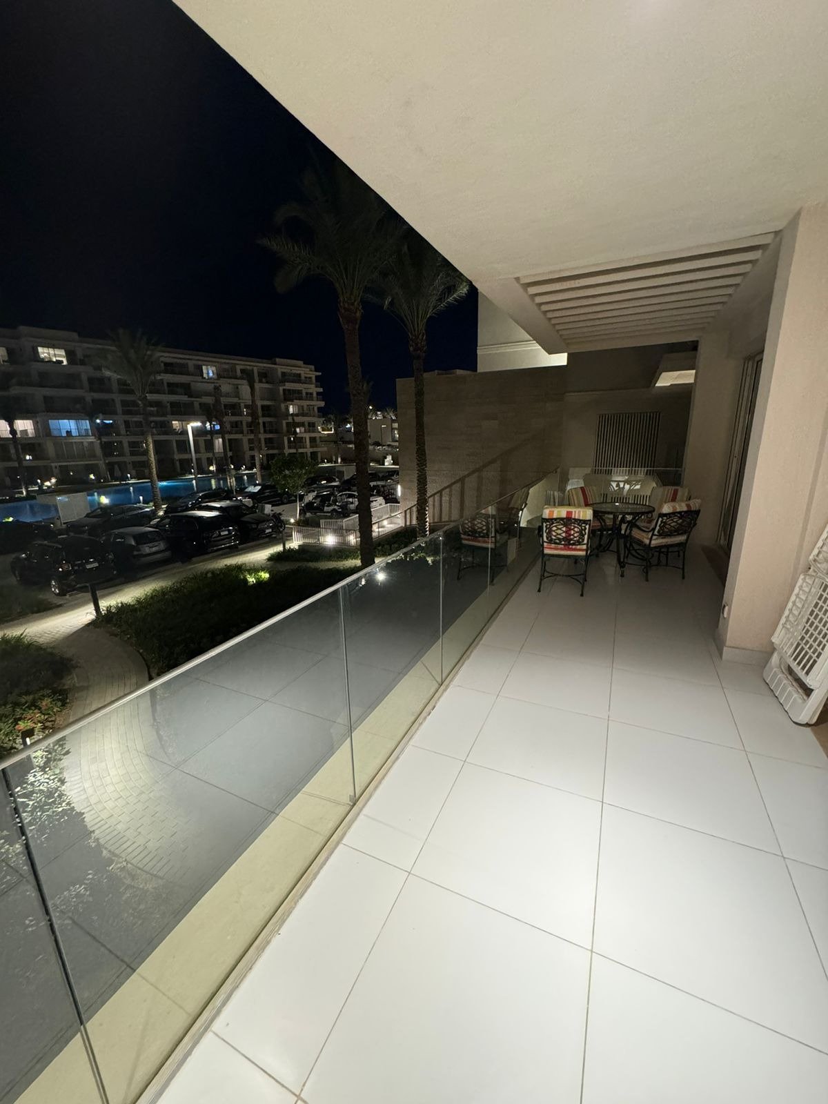 25-marassi-marina-views-293-04 Terrace with seating at night, chalet for rent in Marassi Marina Views, North Coast | تراس بجلسة ليلية، شاليه للإيجار في مراسي مارينا فيوز، الساحل الشمالي