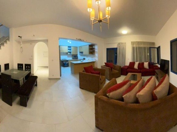 Reception and dining area with stairs to upper floor, villa for rent in Marassi Greek Village, North Coast | ريسيبشن ومنطقة طعام وسلالم للدور العلوي، فيلا للإيجار في مراسي جريك، الساحل الشمالي