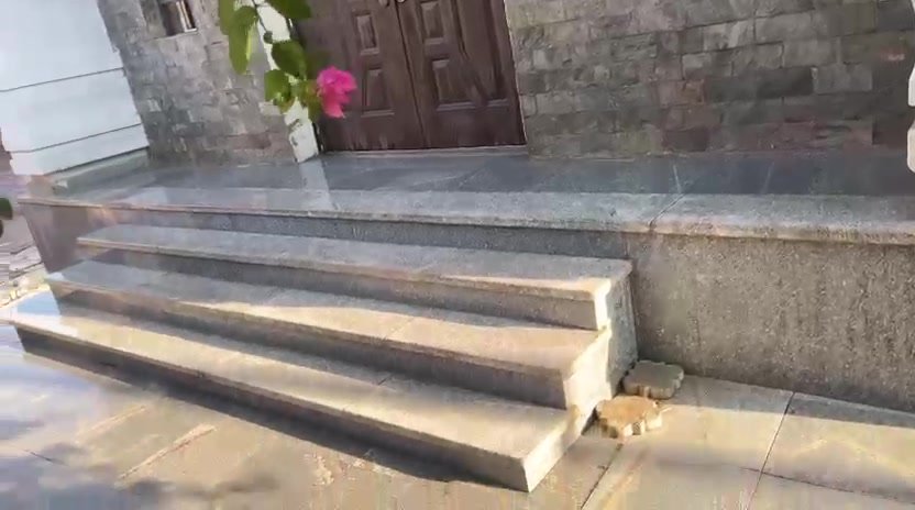 Granite entrance steps beside a stone-clad wall - apartment in 2nd District, 5th Settlement