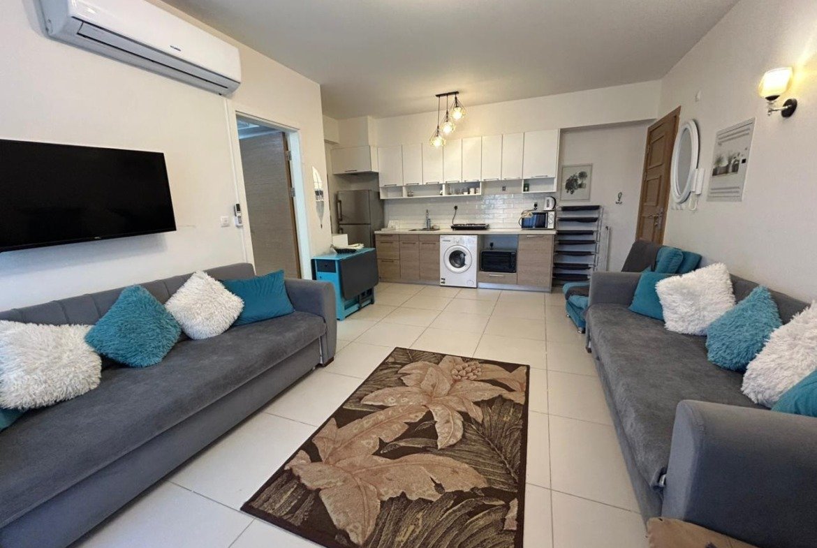 Living area and open kitchen, Marassi Marina 2 North Coast chalet for rent | المعيشة والمطبخ المفتوح، شاليه للإيجار في مراسي مارينا 2 الساحل الشمالي