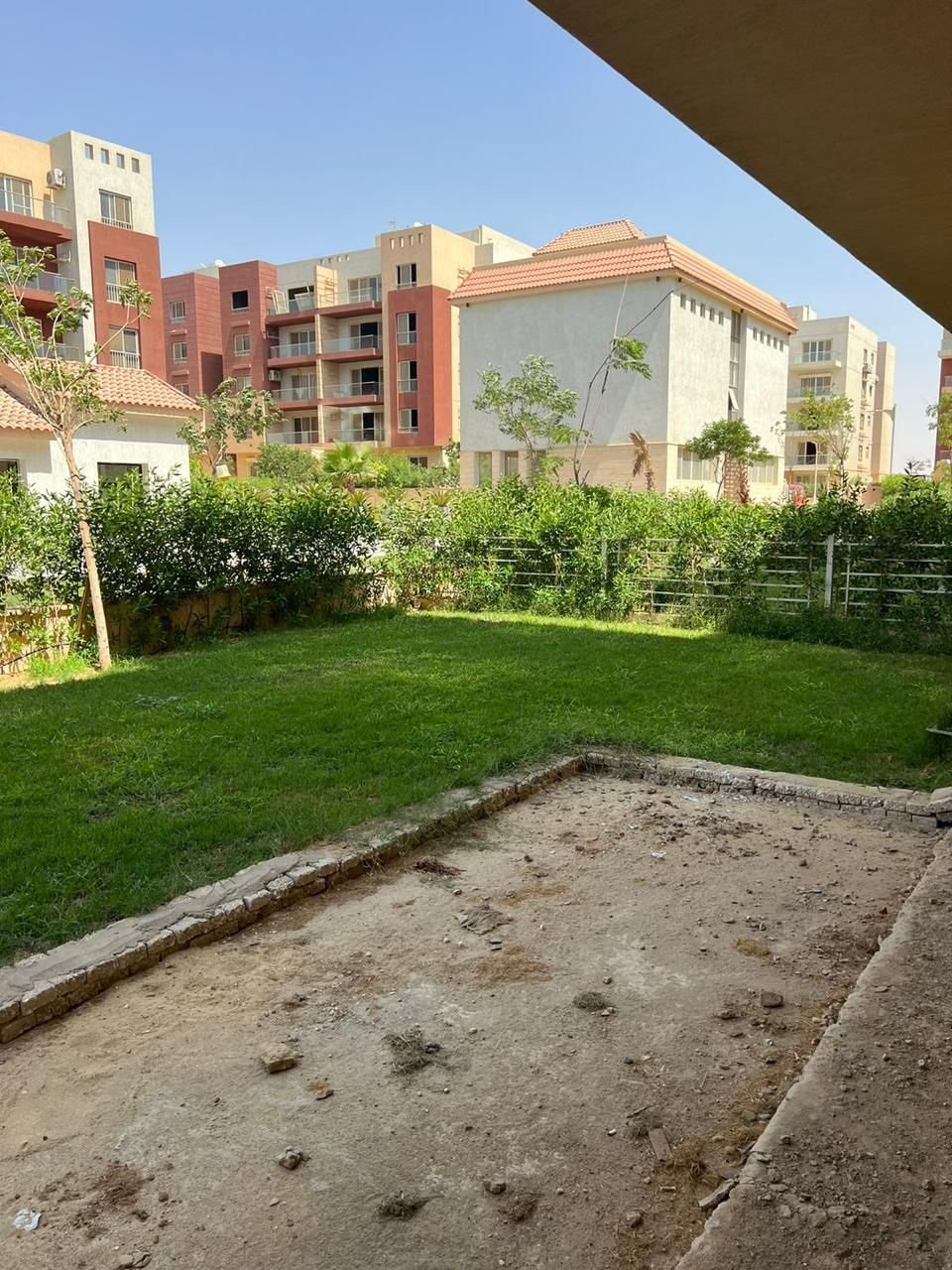 Private garden and surrounding buildings in Promenade, Fifth Settlement, New Cairo, apartment for sale | الحديقة الخاصة والمباني المحيطة في برومناد التجمع الخامس، شقة للبيع