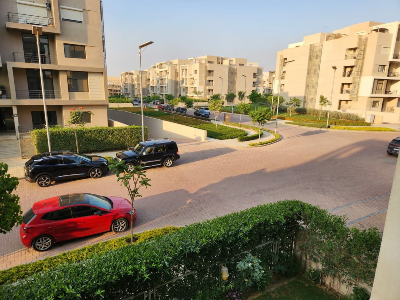 Fifth Square apartment 514-01 Compound street and parked cars seen from the balcony - apartment in Golden Square, Fifth Square, New Cairo