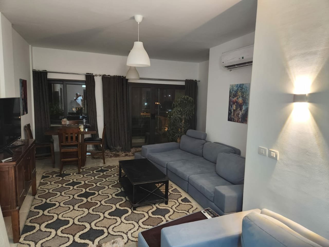 Fifth Square apartment 514-11 Living room with grey sofa and wall light - apartment in Golden Square, Fifth Square, New Cairo