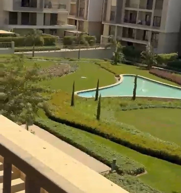 Gardens and pool seen from the balcony - apartment in Fifth Square, New Cairo