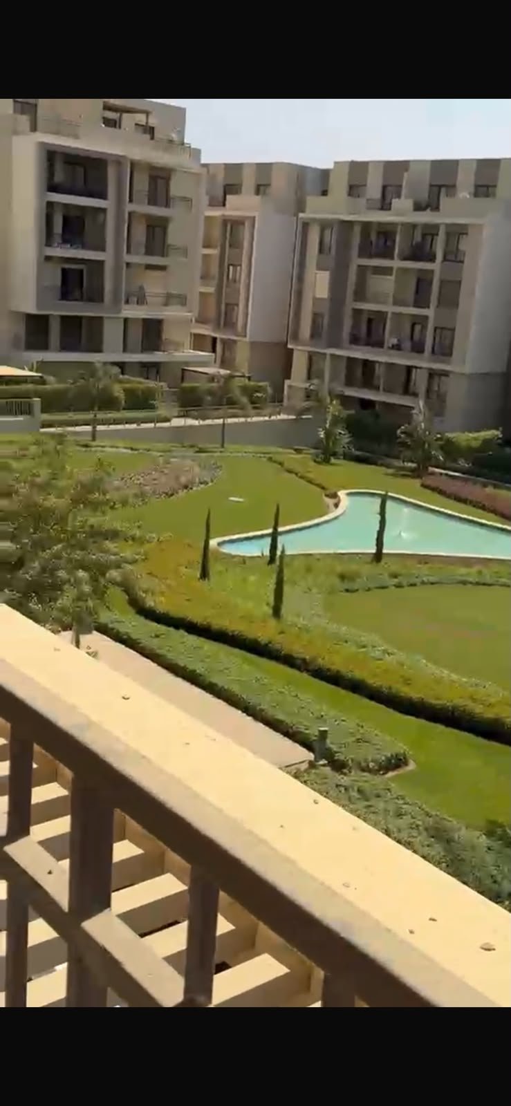 5th-square-apartment-for-rent-461-02 Gardens and pool seen from the balcony - apartment in Fifth Square, New Cairo
