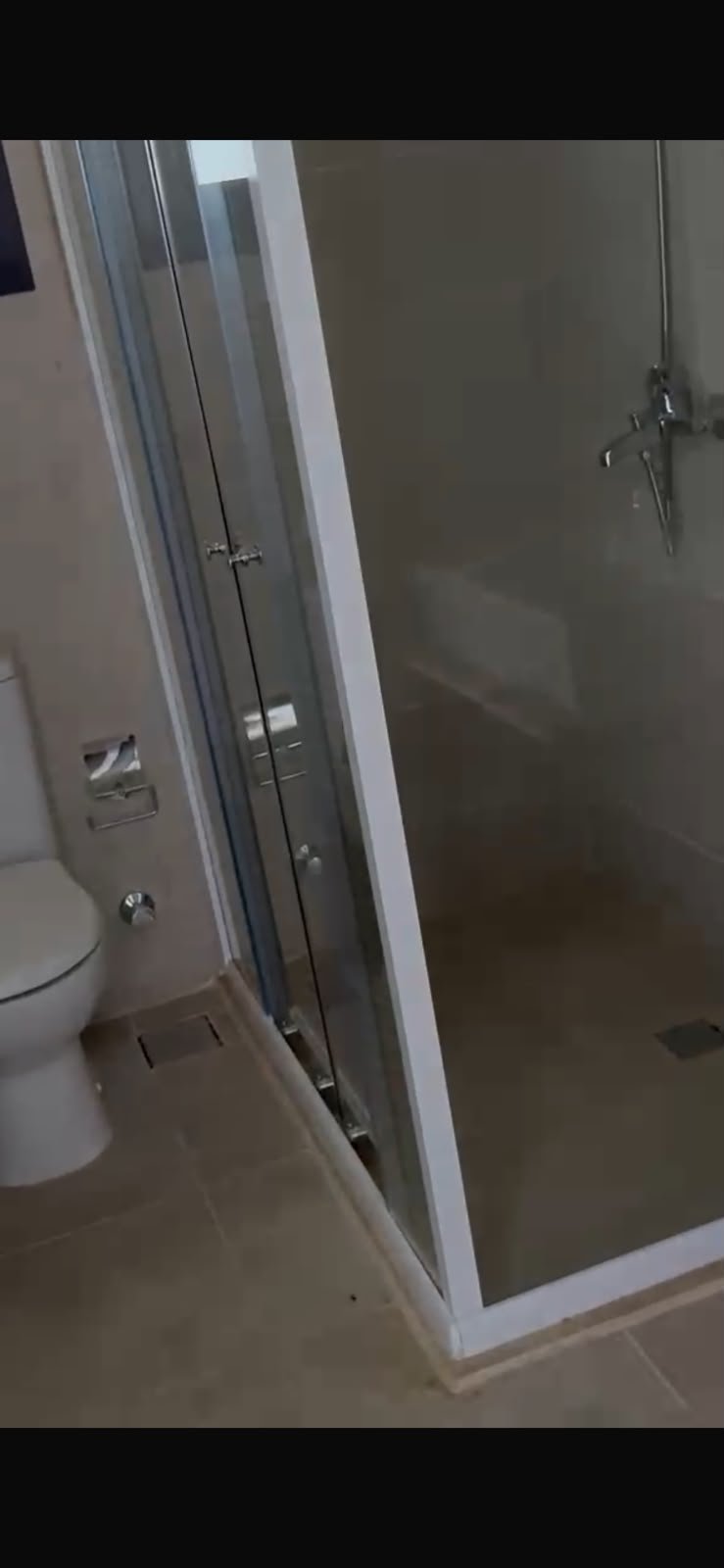 5th-square-apartment-for-rent-461-04 Bathroom with glass shower and toilet - apartment in Fifth Square, New Cairo
