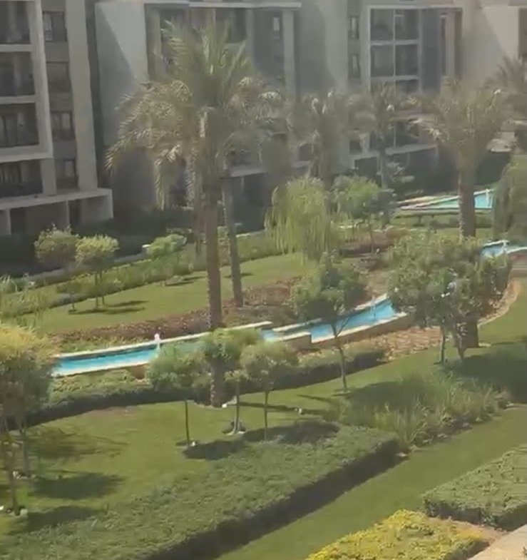 Gardens and buildings seen from the balcony - apartment in Fifth Square, New Cairo