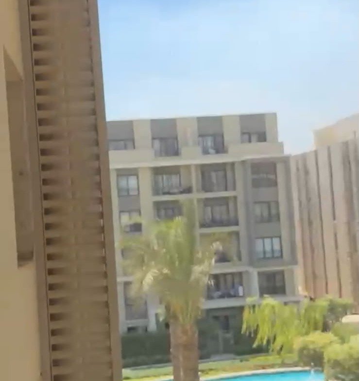 Pool and buildings seen from the balcony - apartment in Fifth Square, New Cairo