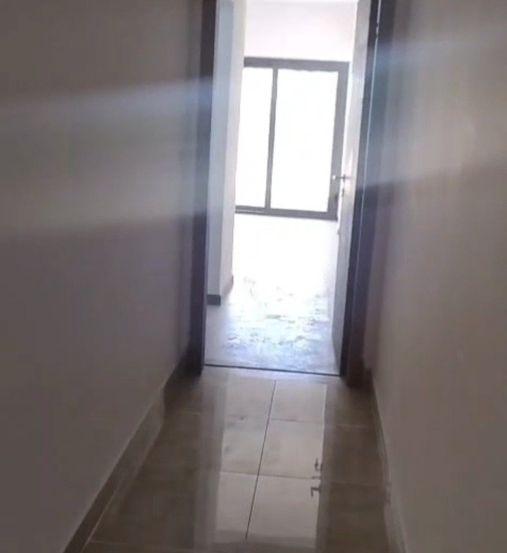 Narrow hallway with window - apartment in Fifth Square, New Cairo