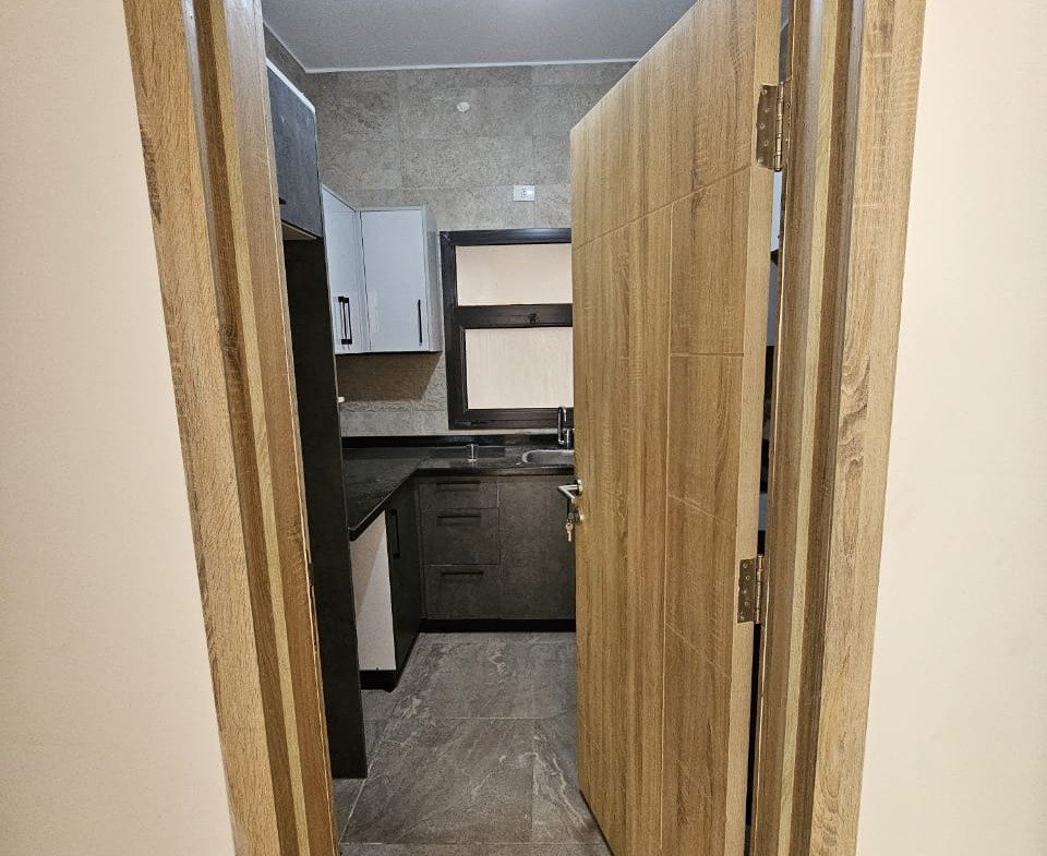 Corridor leading to the kitchen - studio in Fifth Square, New Cairo