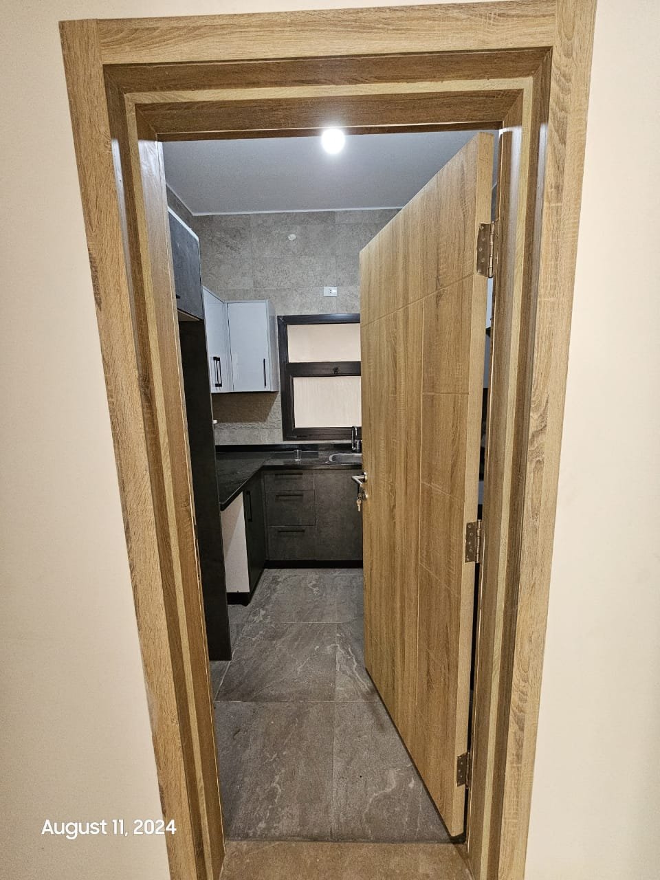 Corridor leading to the kitchen - studio in Fifth Square, New Cairo