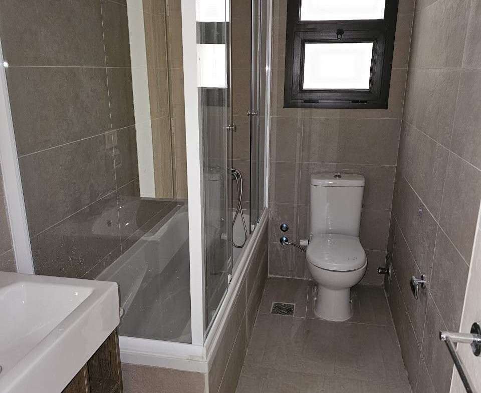 Bathroom with glass shower and toilet - studio in Fifth Square, New Cairo