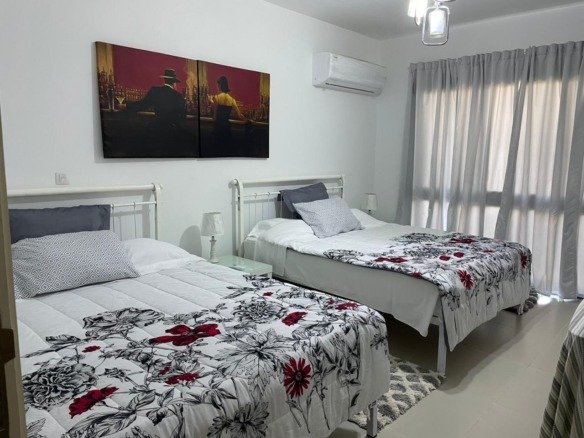 Bedroom with two beds, chalet for rent in Marassi Marina 1, North Coast - R&C Estate | غرفة نوم بسريرين، شاليه للإيجار في مراسي مارينا 1، الساحل الشمالي - R&C Estate