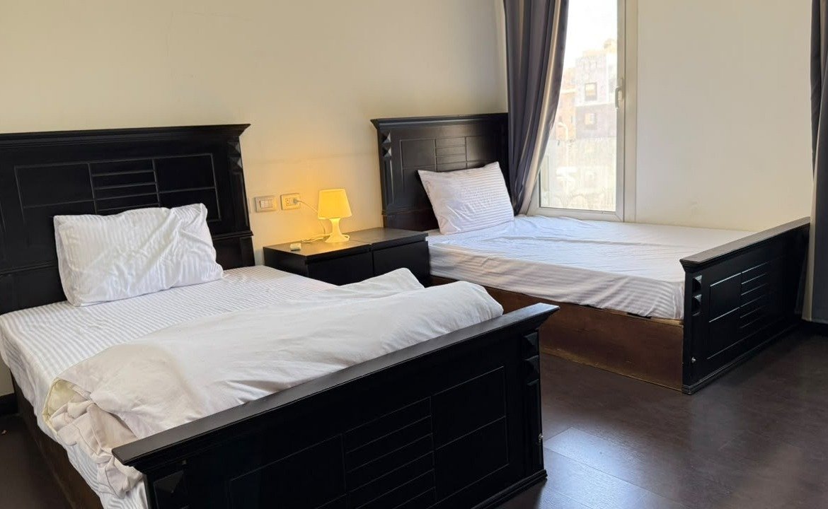 Twin bedroom, The Village garden apartment for sale | غرفة بسريرين، شقة بحديقة للبيع في ذا فيلدج