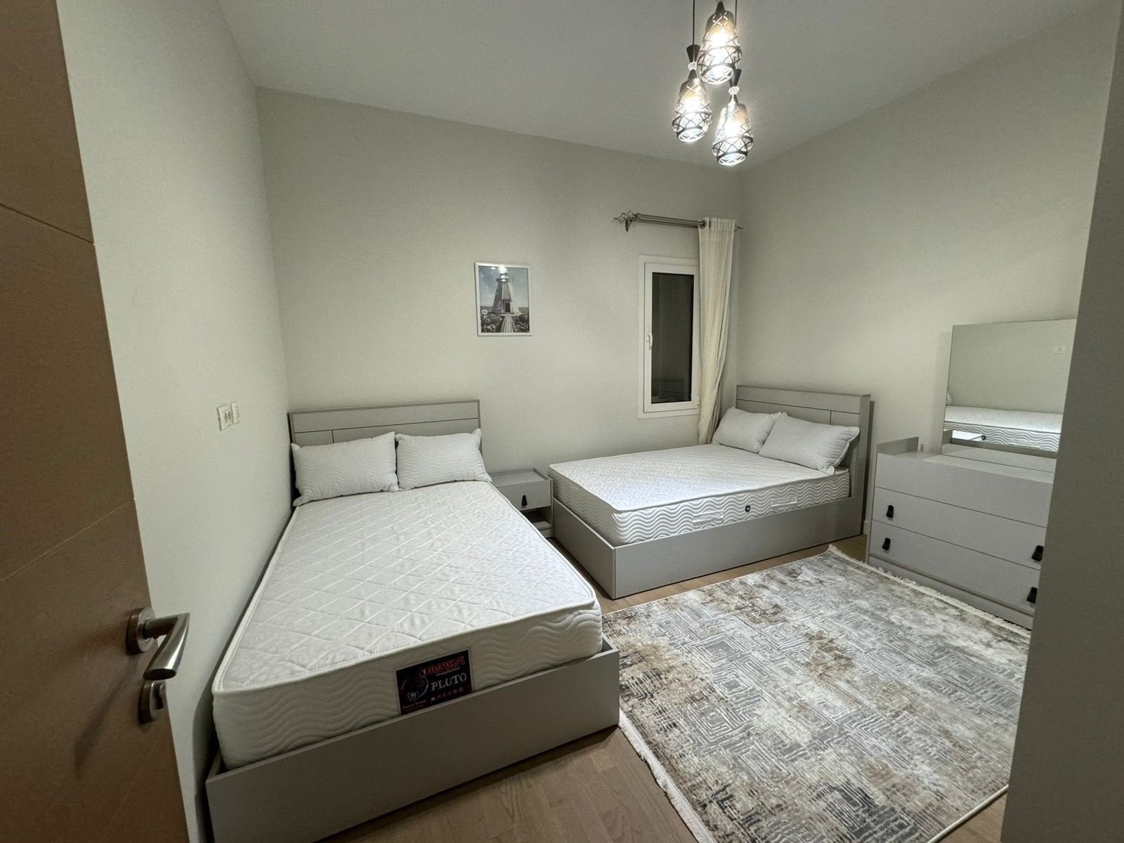 7-mivida-boulevard-apartment-rent-327-06 Twin bedroom with dresser, apartment for rent in Mivida Boulevard, New Cairo | غرفة نوم بسريرين وتسريحة، شقة للإيجار في ميفيدا البوليفارد، القاهرة الجديدة