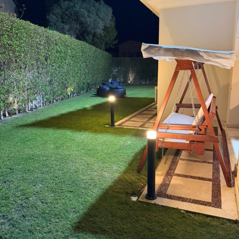 Garden and outdoor swing beside the villa, villa for rent in Marassi Victoria, North Coast | حديقة وأرجوحة خارجية بجوار الفيلا، فيلا للإيجار في مراسي فيكتوريا، الساحل الشمالي