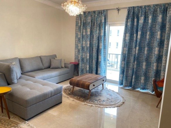 Furnished reception with balcony doors, Mivida Boulevard furnished apartment for rent | ريسيبشن مفروش بأبواب بلكونة، شقة مفروشة للإيجار في ميفيدا بوليفارد