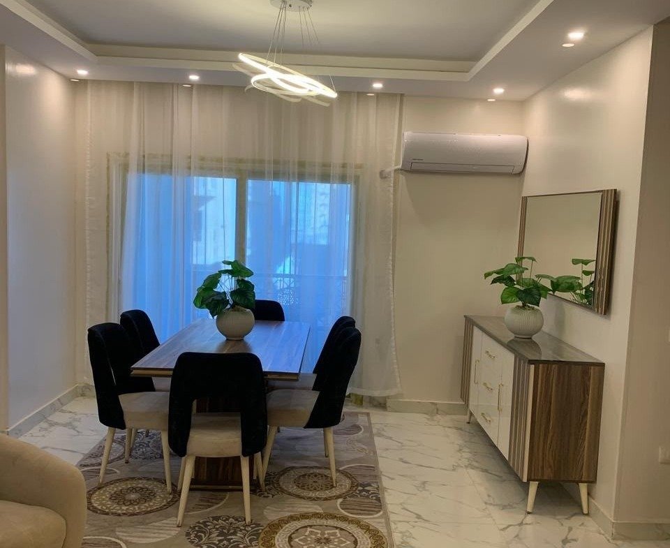 Dining area, furnished apartment for rent in El-Andalos, Fifth Settlement | منطقة السفرة، شقة مفروشة للإيجار في الأندلس بالتجمع الخامس