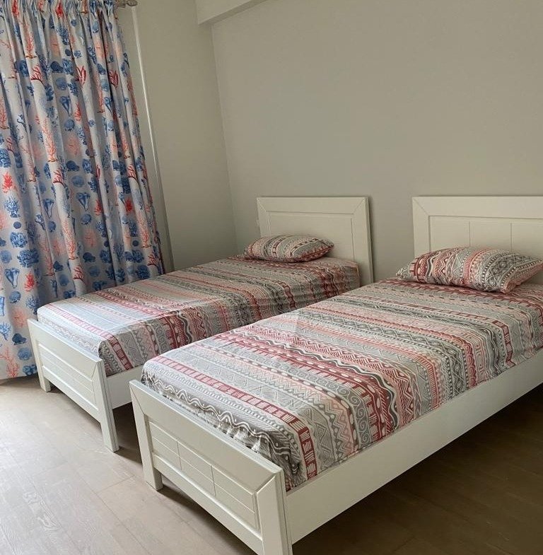 Twin bedroom, Mivida Boulevard furnished apartment for rent | غرفة بسريرين، شقة مفروشة للإيجار في ميفيدا بوليفارد