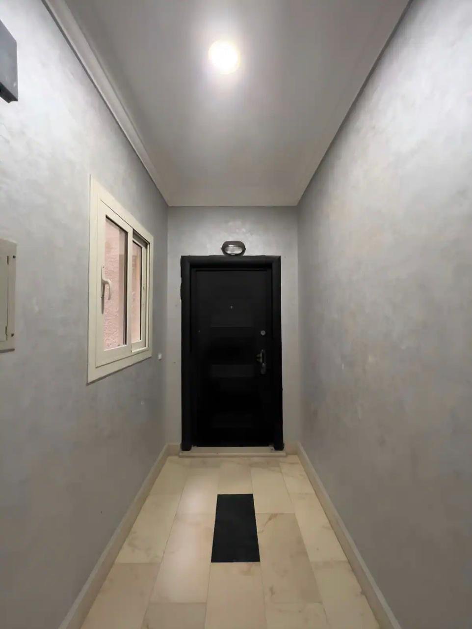 akoya-513-11 Narrow entry corridor leading to the front door - apartment in Akoya, New Cairo