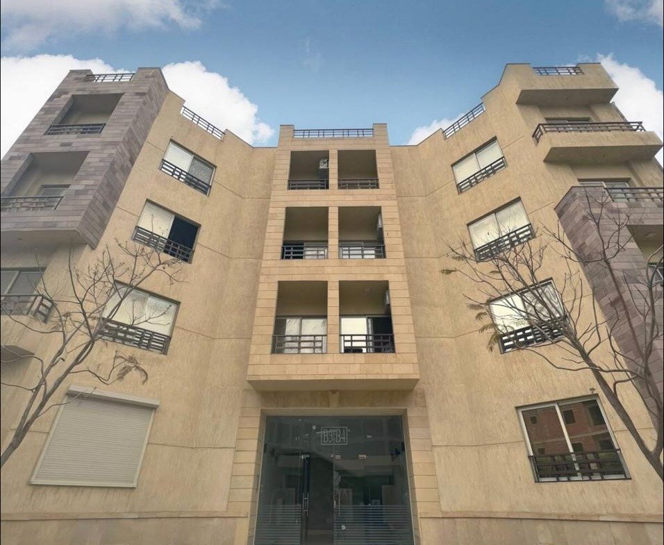Residential building entrance with a tiled facade - apartment in Akoya, New Cairo