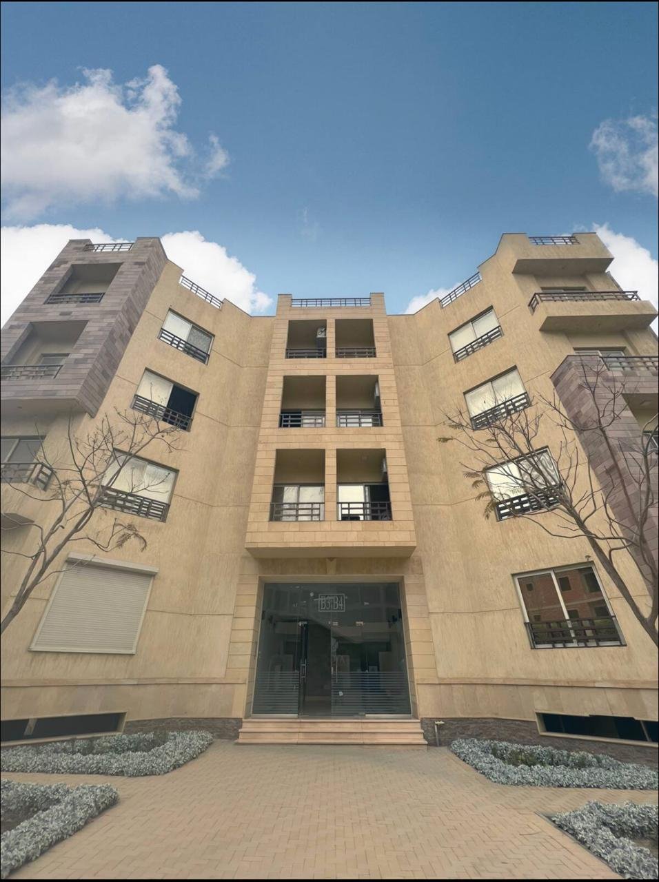 akoya-513-13 Residential building entrance with a tiled facade - apartment in Akoya, New Cairo