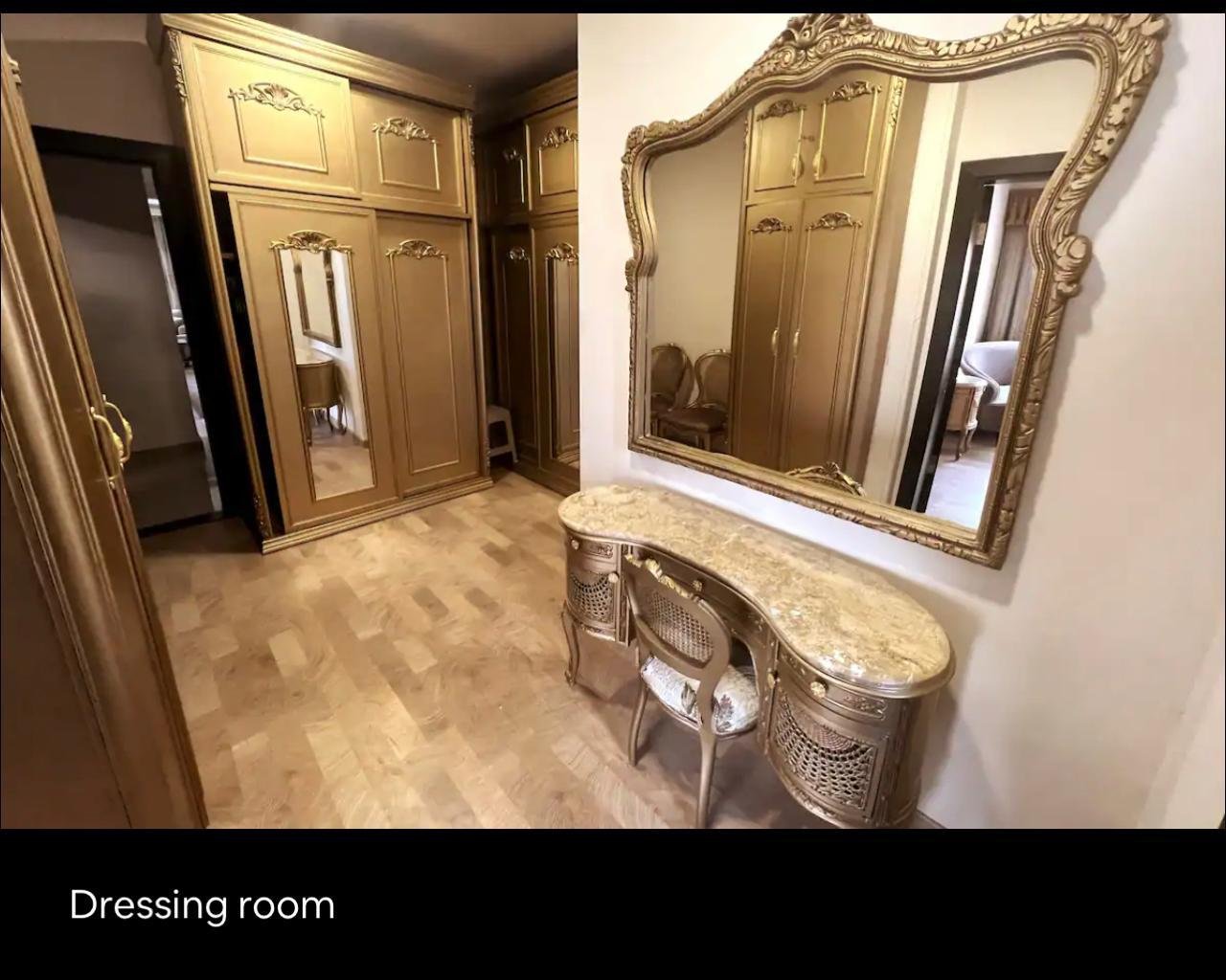 akoya-513-27 Dressing room with a large gilded mirror - apartment in Akoya, New Cairo