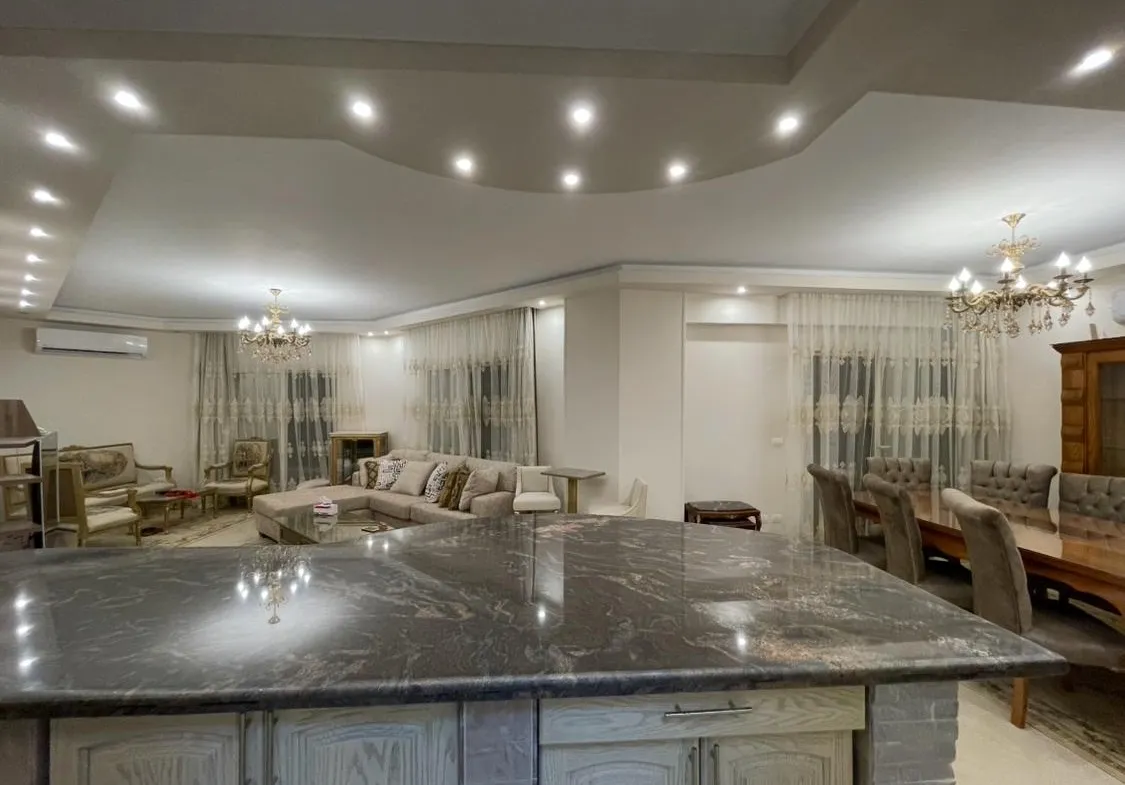 Granite counter in front of the dining and reception areas - apartment in Akoya, New Cairo