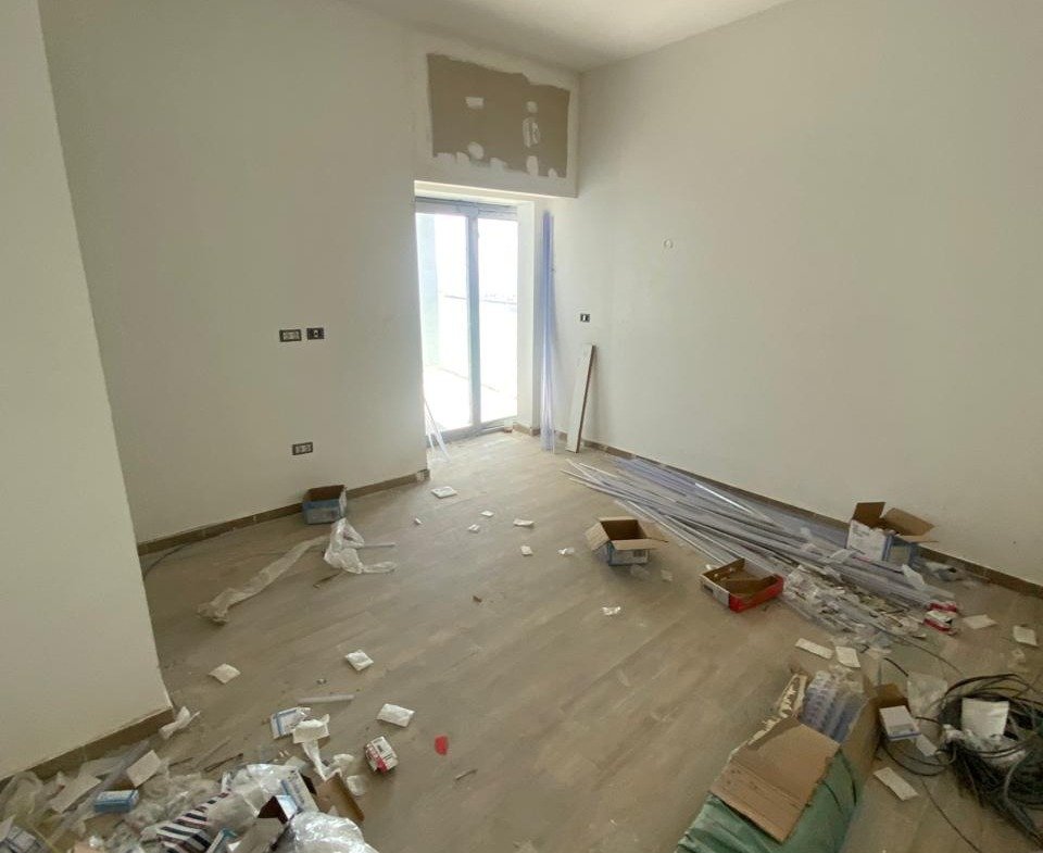 Empty room with painting tools during finishing - chalet in Alamein Towers