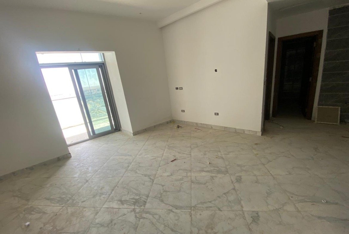 Unfurnished room with marble flooring and a balcony door - chalet in Alamein Towers