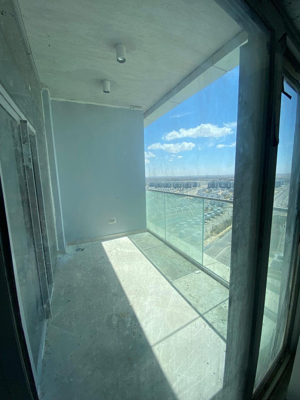 Narrow glass-enclosed balcony with a sea view - chalet in Alamein Towers