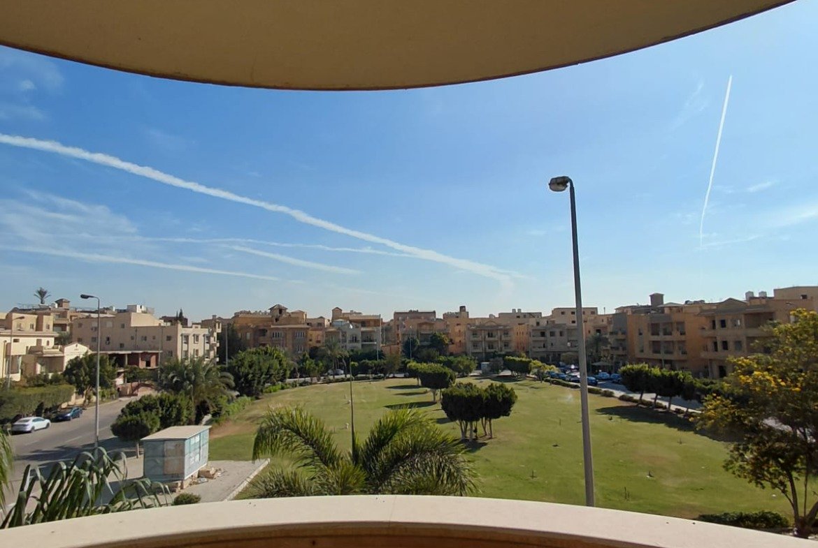 Balcony with balusters overlooking a green park - villa in El Yasmeen 1 Villas, New Cairo
