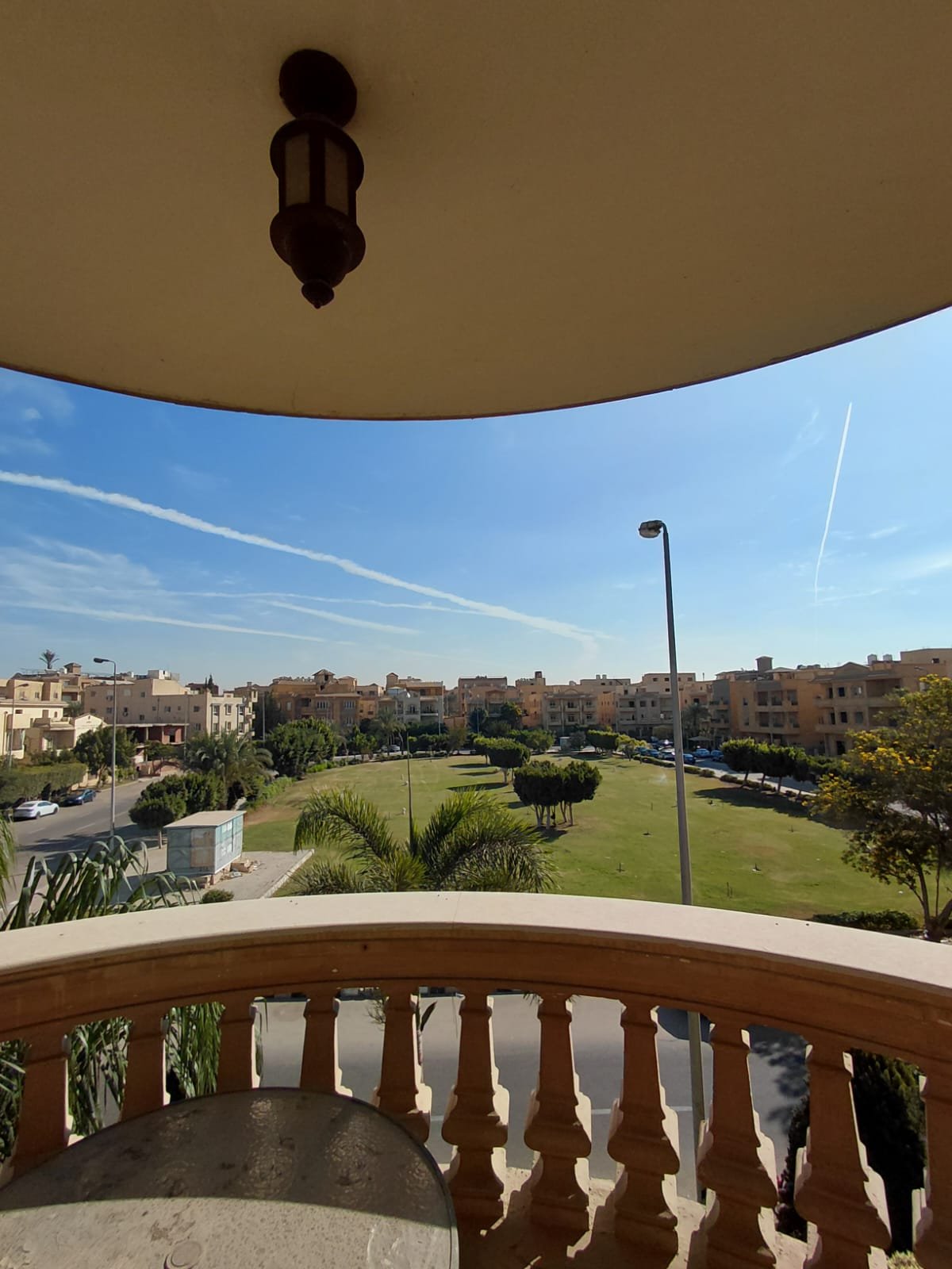 Balcony with balusters overlooking a green park - villa in El Yasmeen 1 Villas, New Cairo