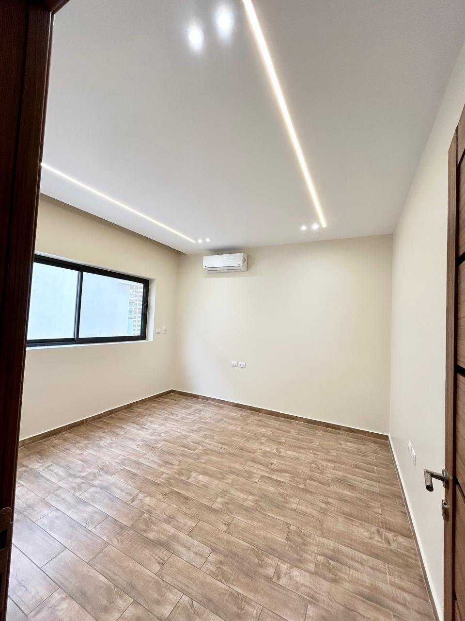 Bedroom with window and LED lighting, apartment for rent in Lake View Residence