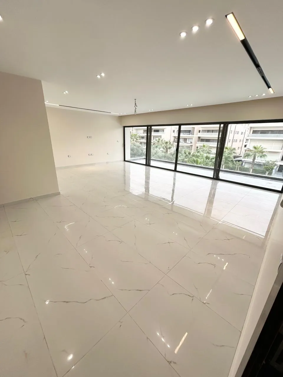 Wide reception with floor to ceiling windows, apartment for rent in Lake View Residence