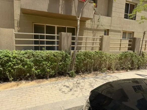 Building exterior and landscaped garden, 5th Square compound