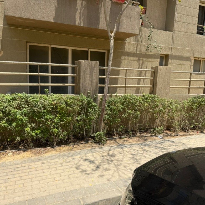 Building exterior and landscaped garden, 5th Square compound
