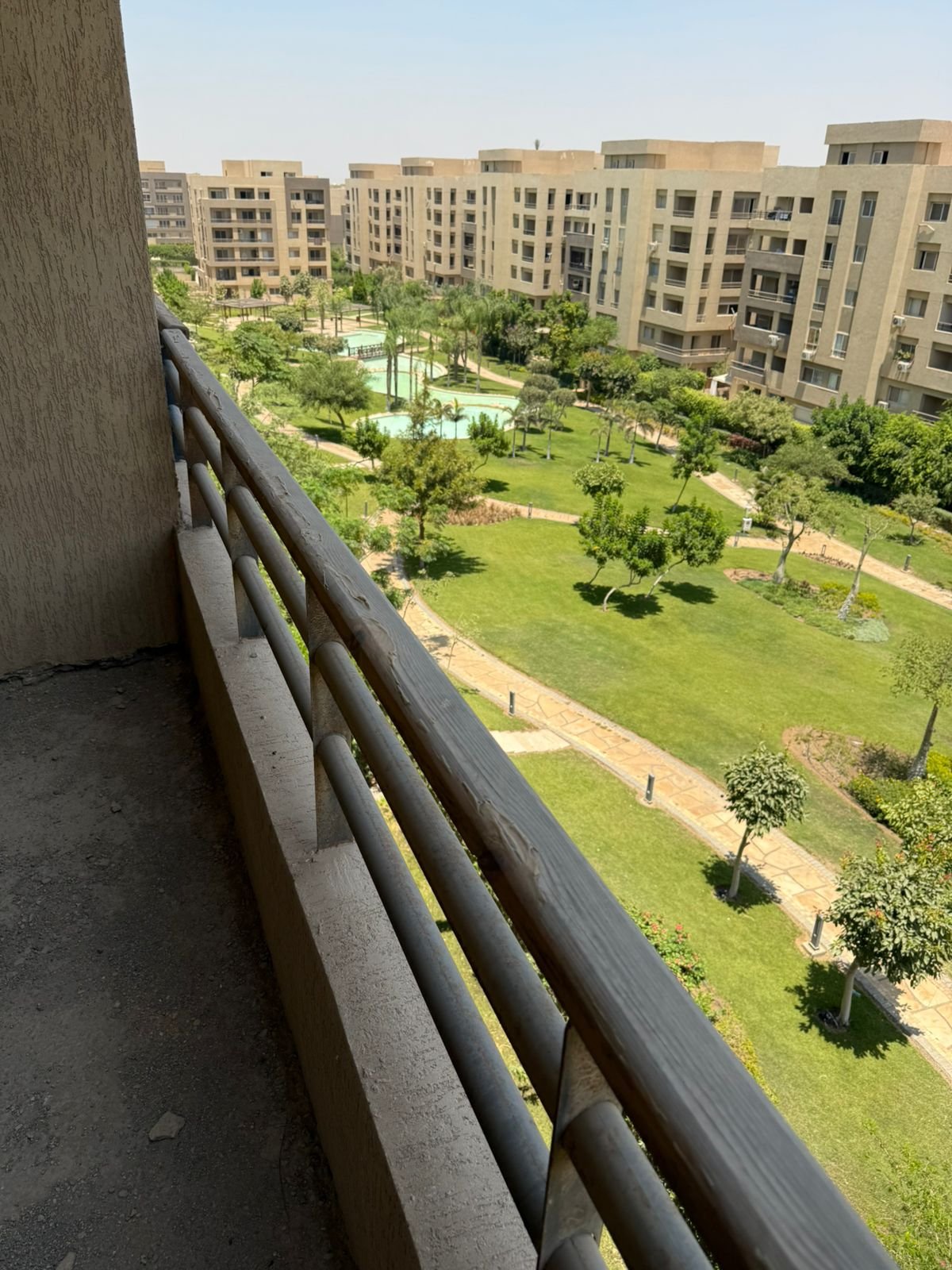 Balcony railing overlooking the gardens - apartment in Fifth Square, New Cairo