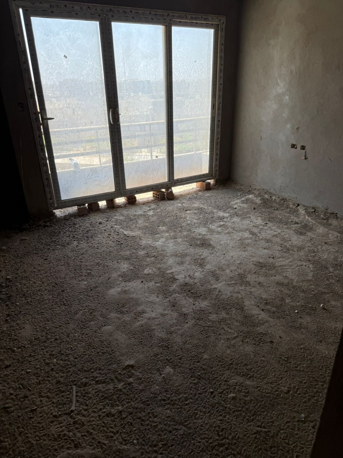 Unfinished room with large windows - apartment in Fifth Square, New Cairo