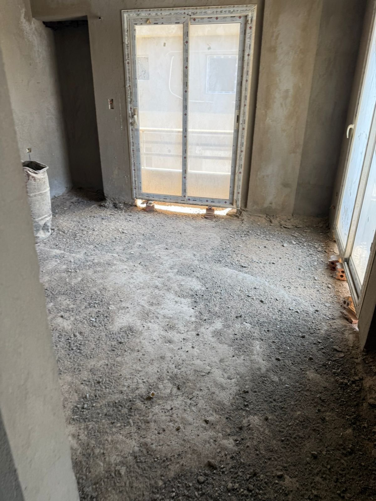Unfinished room with balcony door and window - apartment in Fifth Square, New Cairo